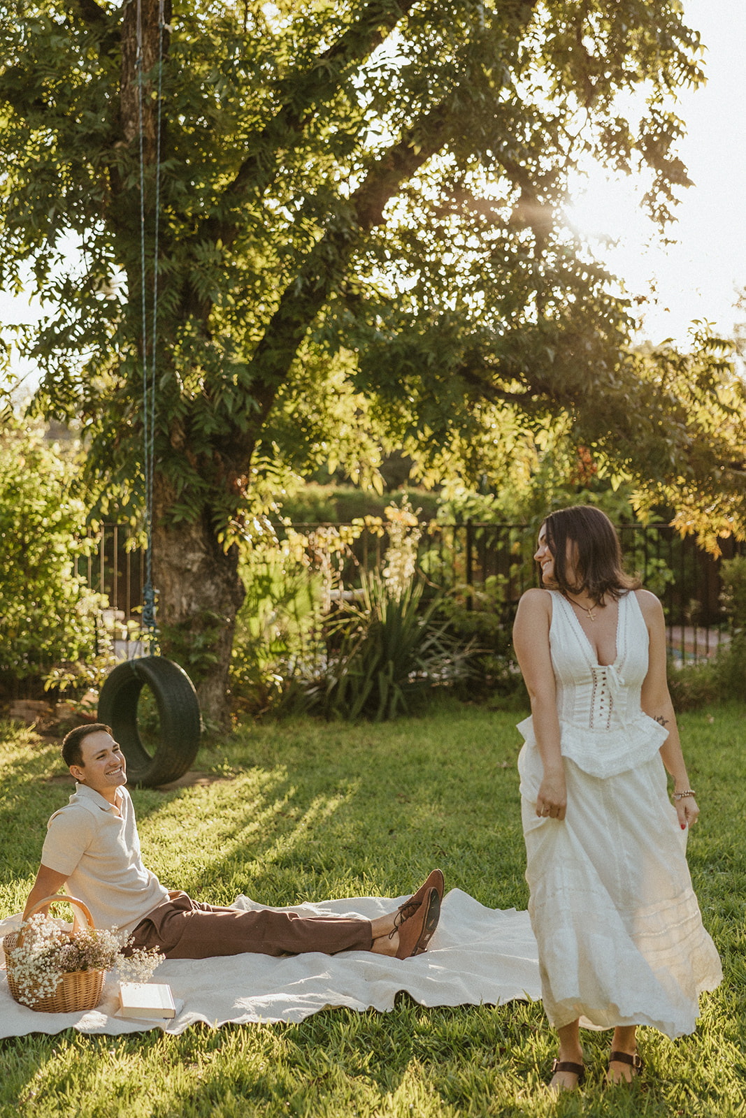 A woman spinning during engagement photos