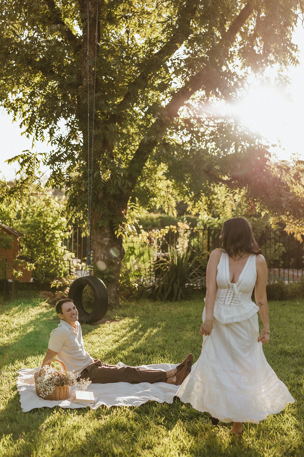 A woman spinning during engagement photos