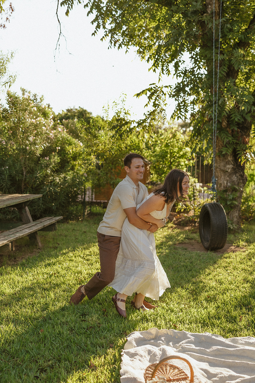 A couple running during their engagement photos