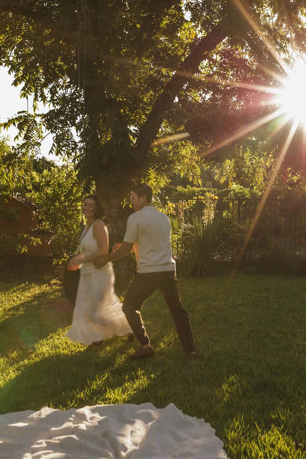 A couple running during their engagement photos