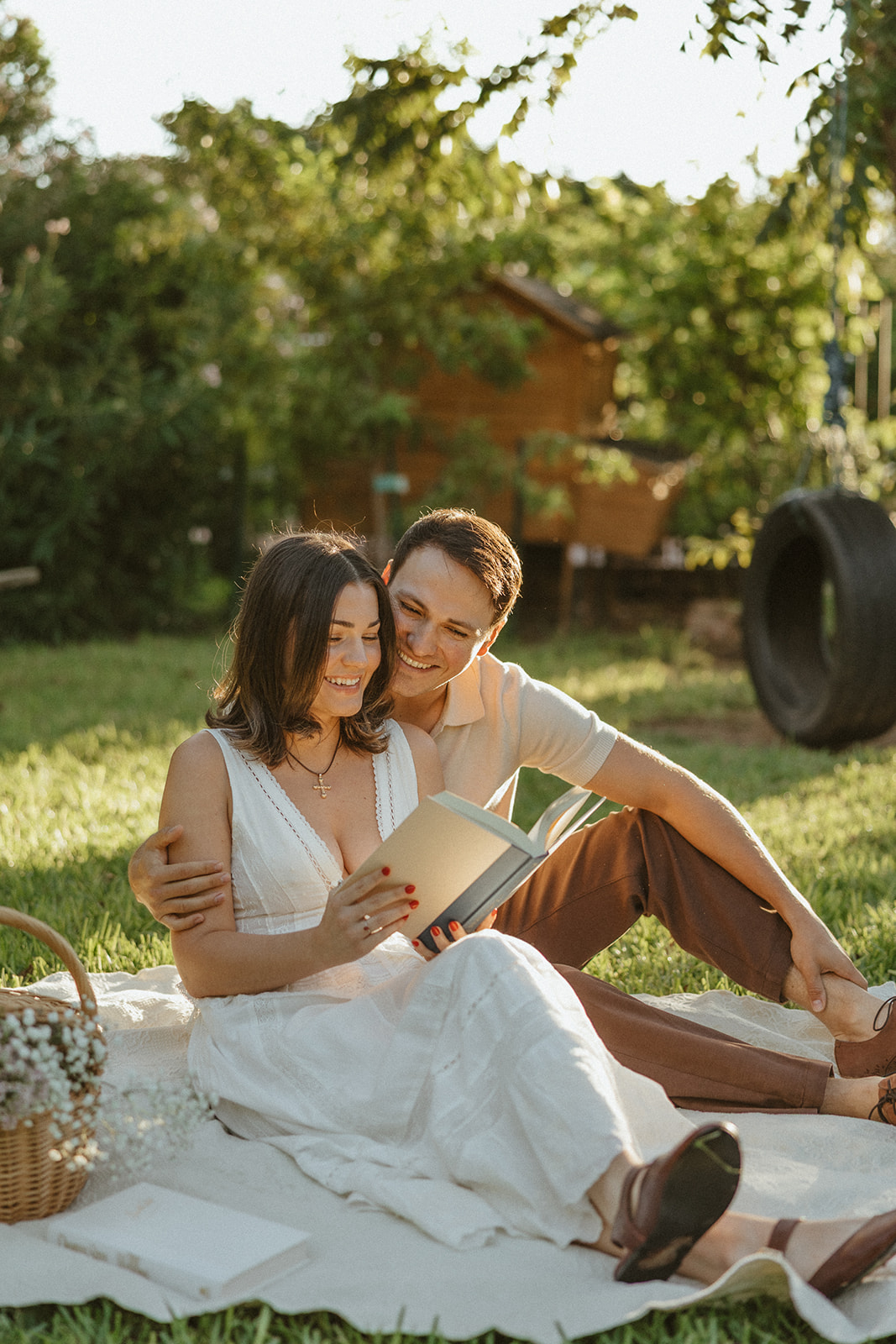 A couple during a picnic for engagement photos