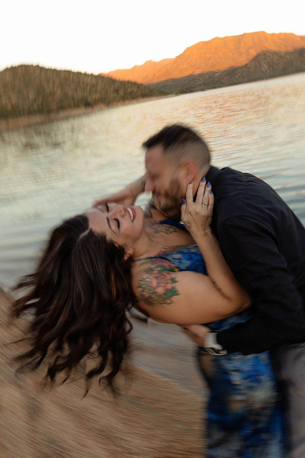 Blurry engagement photos of a couple at Bartlett Lake in Arizona